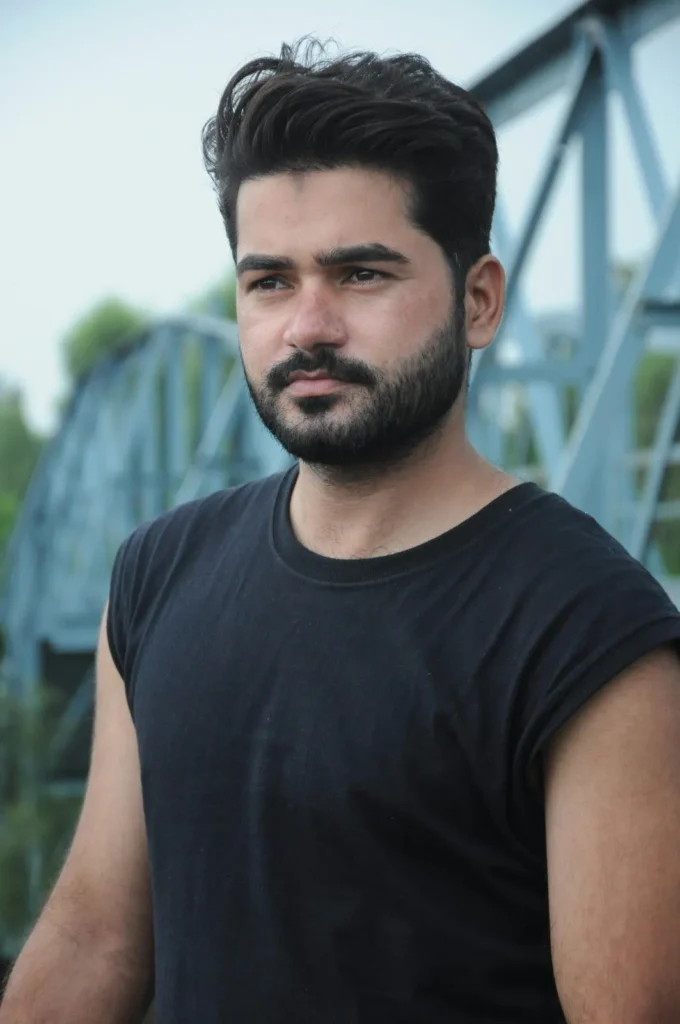 Man with thick beard using beard balm