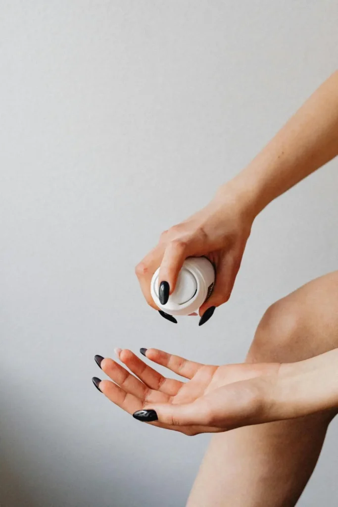 Applying body lotion for men